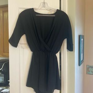 Pretty little thing, size 0, very low cut short sleeve, black romper